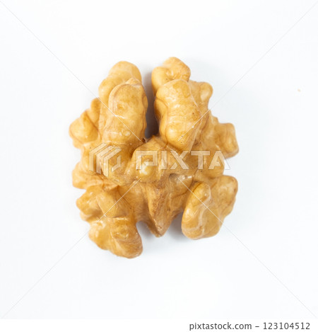 Macro peeled walnut, kernel, white isolate background, top view. Macro peeled walnut, kernel, white isolate background, top view. 123104512