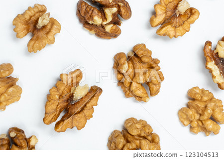 Walnut kernels, white background, top view. Walnut kernels, white background, top view. 123104513
