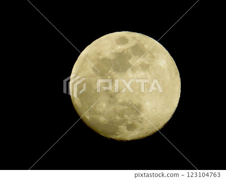 A perfectly round moon floating in the sky 123104763