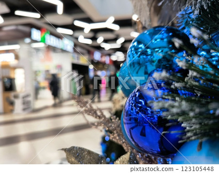 Abstract Twinkling Lights and Particles Creating a Magical Christmas Background. The shopping center before Christmas is bokeh. Abstract Twinkling Lights and Particles Creating a Magical Christmas Background. The shopping center before Christmas is bokeh. 123105448