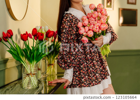 young girl with tulips in her hands. tulip festival in spring. women's day march 8 123105664