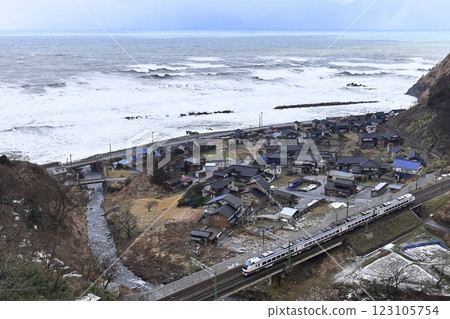 Limited express "Shirayuki" running on the Shin-Etsu main line in winter Limited express "Shirayuki" running on the Shin-Etsu main line in winter 123105754