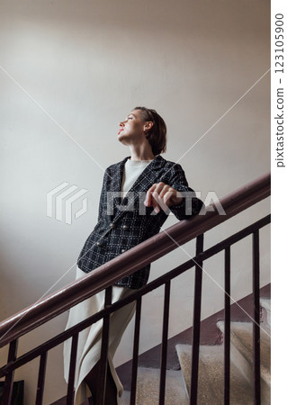 woman 40 years old standing on the stairs woman 40 years old standing on the stairs 123105900