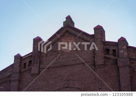 The facade of an old, abandoned factory in Minsk 123105988