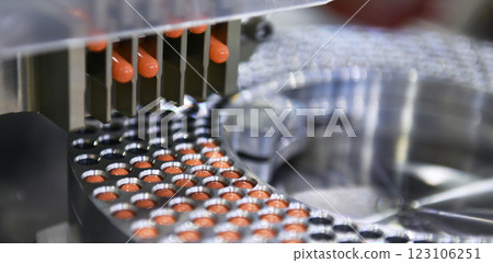 Capsule medicine pill production line, Industrial pharmaceutical concept.	 123106251