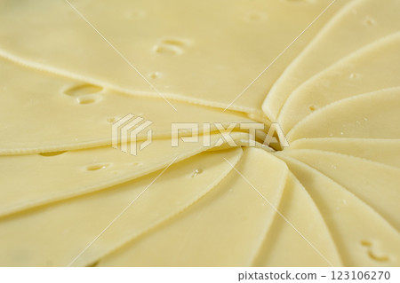 Semi-hard cheese close-up, thin slices. 123106270