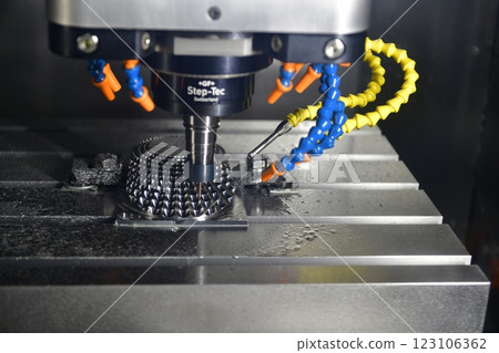 The 5-axis CNC milling machine cutting the automotive part with solid ball end mill tool. 123106362