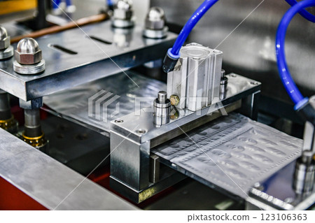 Aluminum foil blister pack packaging to protect from light in production line, Industrial pharmaceutical concept 123106363