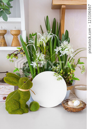 Decorative moss bunny and blank round shape and spring flowers and eggs. Easter mockup, template Decorative moss bunny and blank round shape and spring flowers and eggs. Easter mockup, template 123106867