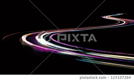 Light trails illuminating winding road at night creating dynamic streaks 123107264