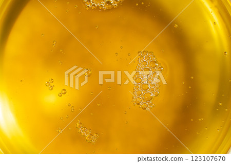 Unrefined cold pressed sesame oil in a glass bowl. Unrefined cold pressed sesame oil in a glass bowl. 123107670