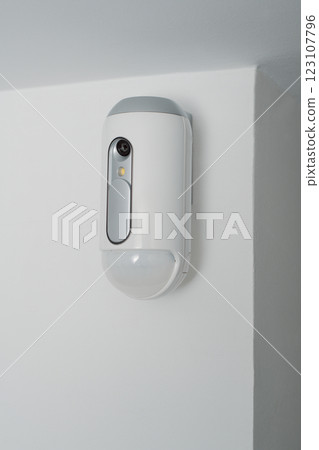 motion detector equipped with a camera indoors 123107796