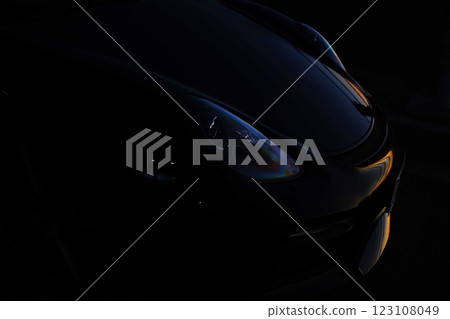 Black sports car at sunset 123108049