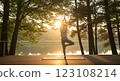 young woman practicing yoga in the park 123108214