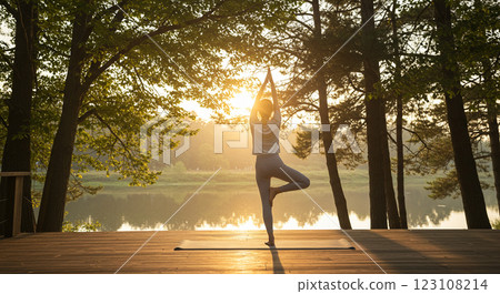 young woman practicing yoga in the park 123108214