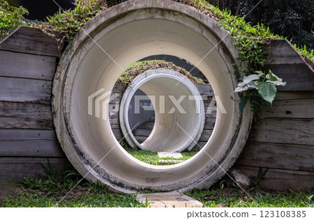 Park concrete tunnel made for Children's play as a rabbit, ducking through its numerous burrows. 123108385