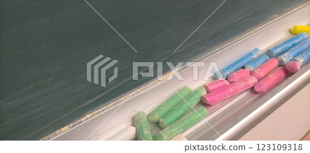 A blackboard and lots of chalk A blackboard and lots of chalk 123109318