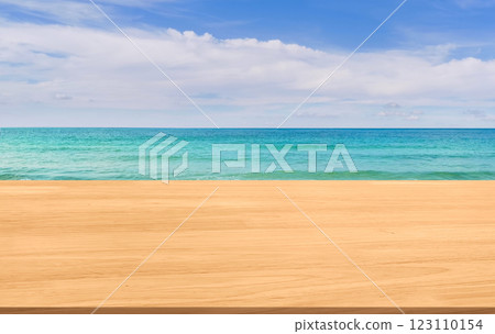 Empty wooden table with beautiful beach, sea and sky in the background. Empty wooden table with beautiful beach, sea and sky in the background. 123110154