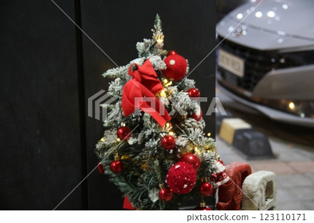red christmas tree with decorated decoration 123110171