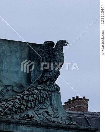 Eagle statue watching over the city Eagle statue watching over the city 123110444