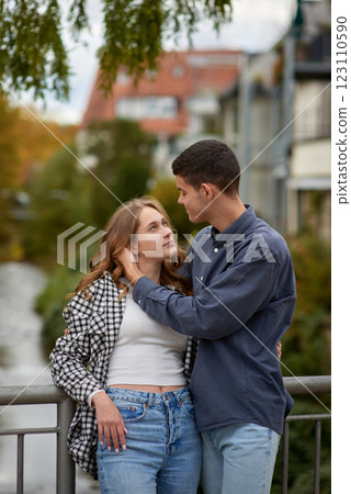 Young Cute Female Hugs Boyfriend. In Autumn Outdoor. Lovers Walking in Park. Attractive Funny Couple. Lovestory in Forest. Man and Woman. Cute Lovers in the Park. Family Concept. Happy Couple. 123110590