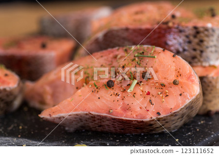 Close-up of fresh salmon steak with spices 123111652