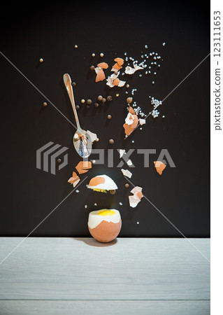 Black background, minimalism and egg in section Black background, minimalism and egg in section 123111653