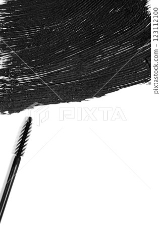 The texture of black mascara and an eyelash brush. Copy space The texture of black mascara and an eyelash brush. Copy space 123112100