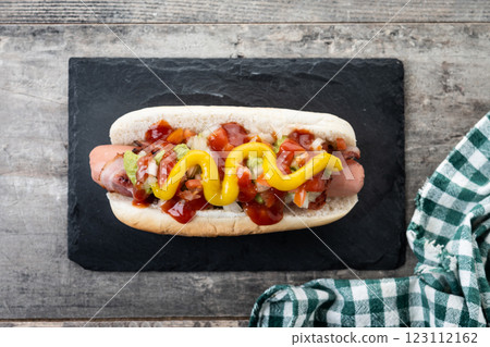 Sonoran hot dog. Traditional Mexican hot dog on wooden table 123112162