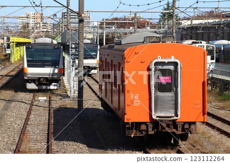 Chuo Line 201 series train parked at Toyota Vehicle Center: Kuha 201-1 (Hino City, Tokyo) 123112264