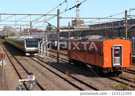 Chuo Line 201 series train parked at Toyota Vehicle Center: Kuha 201-1 (Hino City, Tokyo) 123112265