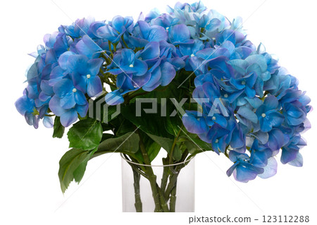 Realistic silicone and latex blue flowers in a clear vase for home decoration or event arrangement Realistic silicone and latex blue flowers in a clear vase for home decoration or event arrangement 123112288
