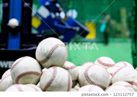 Pitching machine and baseballs at Hanshin Naruohama Stadium Pitching machine and baseballs at Hanshin Naruohama Stadium 123112757