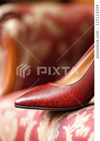 Cherry-colored high-heeled shoes rest elegantly against retro furniture, showcasing a romantic look 123113244