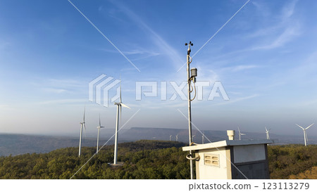 Win measuring device at a windmill power generator farm. 123113279