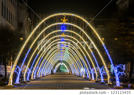 Night view of New Year or Christmas decorative arches with bright lights during winter holidays in Ivano-Frankivsk city, Ukraine. 123113435