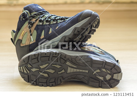 New fashionable hiking mountain boots. Modern leather trekking footware. 123113451