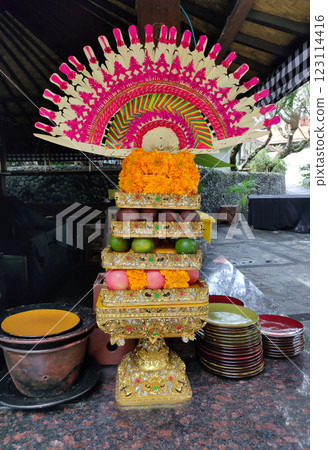 Traditional balinese offerings to gods in Bali with flowers and aromatic sticks Traditional balinese offerings to gods in Bali with flowers and aromatic sticks 123114416