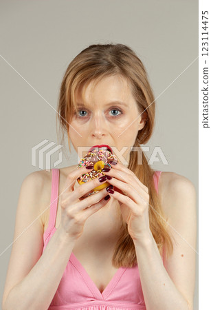 Woman with unhealthy eating habits 123114475