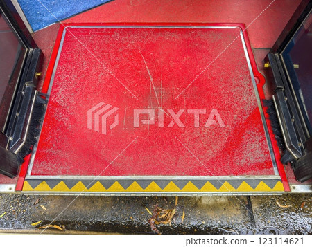 The well used entry floor to a commercial passenger bus The well used entry floor to a commercial passenger bus 123114621
