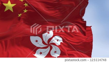 Flags of Hong Kong and China waving in the wind on a clear day 123114748