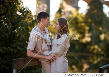 Young Cute Female Hugs Boyfriend. In Autumn Outdoor. Lovers Walking in Park. Attractive Funny Couple. Lovestory in Forest. Man and Woman. Cute Lovers in the Park. Family Concept. Happy Couple. 123115053
