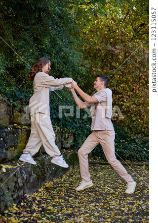 Young Cute Female Hugs Boyfriend. In Autumn Outdoor. Lovers Walking in Park. Attractive Funny Couple. Lovestory in Forest. Man and Woman. Cute Lovers in the Park. Family Concept. Happy Couple. Young Cute Female Hugs Boyfriend. In Autumn Outdoor. Lovers Walking in Park. Attractive Funny Couple. Lovestory in Forest. Man and Woman. Cute Lovers in the Park. Family Concept. Happy Couple. 123115057