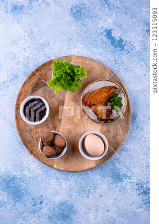 Traditional Passover Seder plate with symbolic foods. Symbolic of Jewish holiday Pesah. Traditional Passover Seder plate with symbolic foods. Symbolic of Jewish holiday Pesah. 123115093
