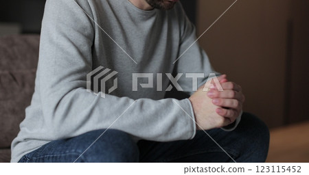 Young man feels concerned due to bad life situation, debt or divorce. Lost in sad thoughts thinking of life or relationships problems. 123115452