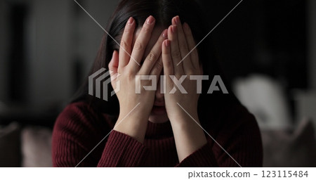 Worried young woman having psychological problem, feeling anxiety looks stressed, nervous sit on sofa. Human emotions concept. 123115484