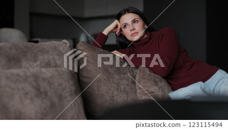 Hopeless depressed woman at sofa thinking relationships difficulties feeling sad. Human emotions concept. Hopeless depressed woman at sofa thinking relationships difficulties feeling sad. Human emotions concept. 123115494
