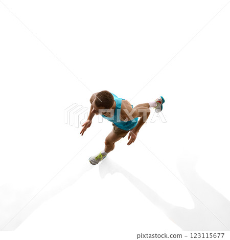 Aerial view of athlete sprinting, strong posture and focused motion showcasing speed against white studio background. Aerial view of athlete sprinting, strong posture and focused motion showcasing speed against white studio background. 123115677