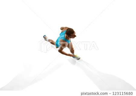 Overhead view of athlete sprinting, powerful body mechanics and swift movement defining competitive energy against white studio background. Overhead view of athlete sprinting, powerful body mechanics and swift movement defining competitive energy against white studio background. 123115680