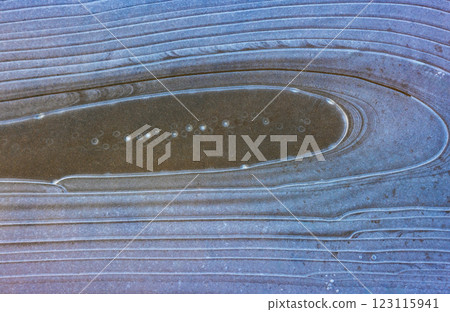 Frozen water on the ground, pattern of ice 123115941